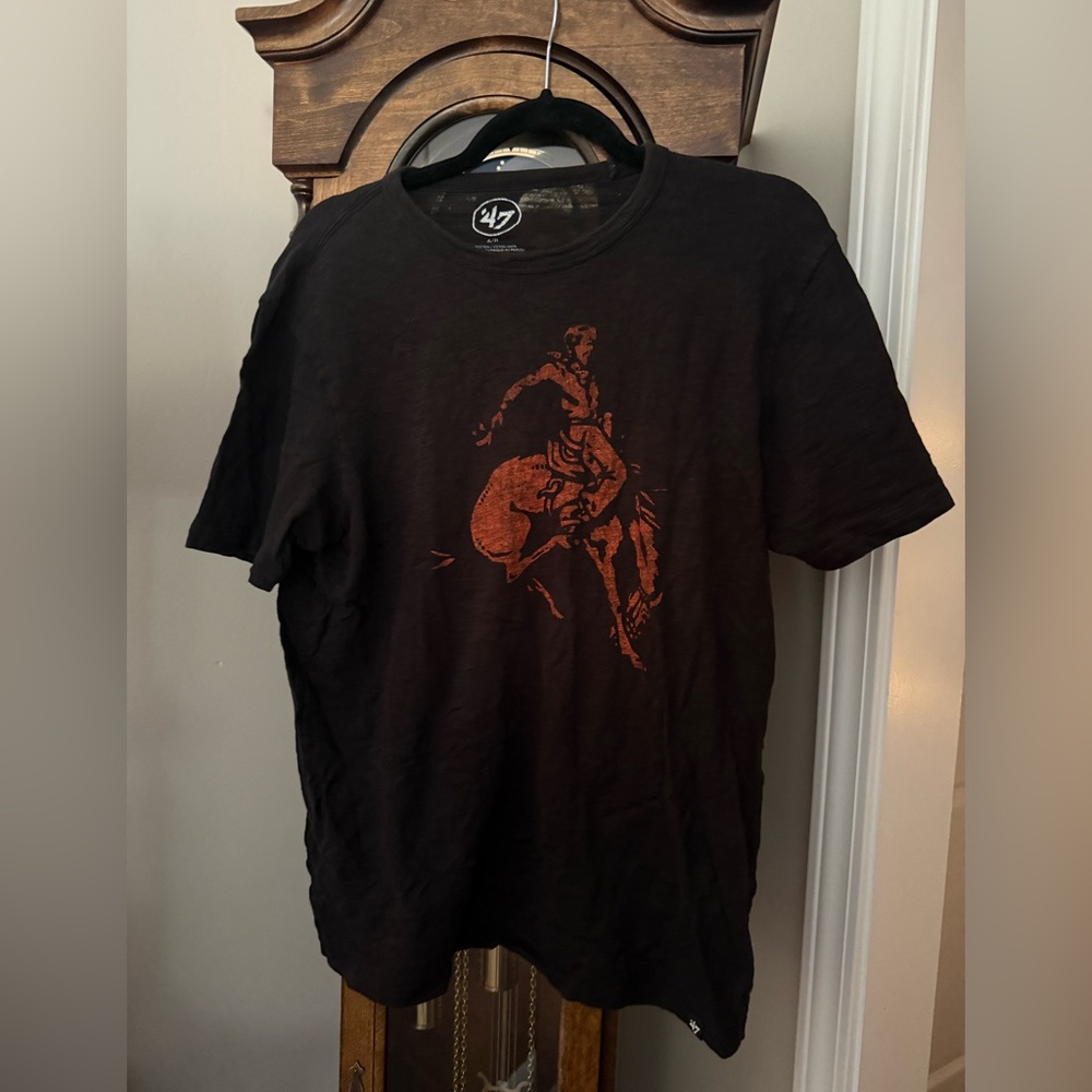 47 Scrum Cowboy Stencil shirt size
Small Oklahoma state
